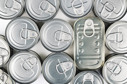 Top view of a lot of canned food stored at home for use, for example, in times of quarantine by Coronavirus Covid-19. Nonperishable food.