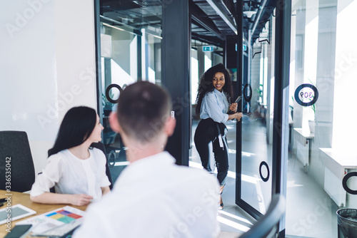 Black woman entering to meeting room