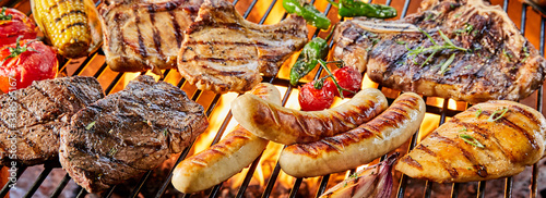 Large assortment of meat grilling on a barbecue