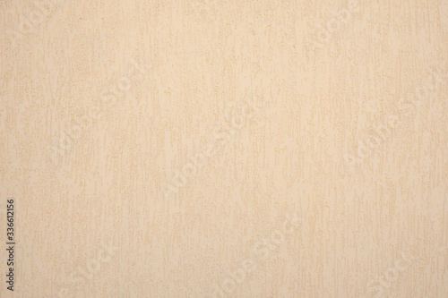 beige rough wall with a milky tint
