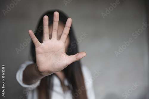 woman raised her hand for dissuade, Abuse, campaign stop violence against women. Stop sexual harassment and rape.