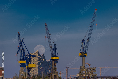 Full moon in Hamburg in the harbour over the Elbphilharmonie
