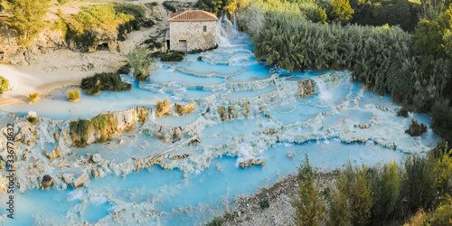 Saturnia natural spa with waterfalls and hot springs at Saturnia thermal baths, Grosseto, Tuscany, Italy. Beautiful panoramic shot.