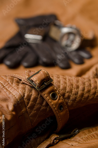 Men's leather gloves, steel watch and leather men's jacket.