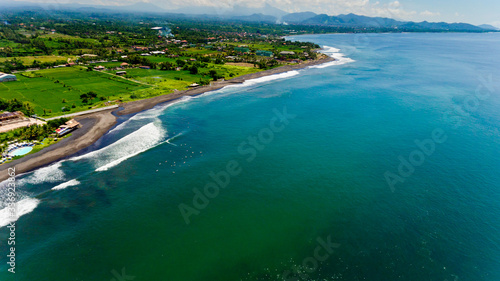 Aerial view of black sand beach. A place to surf.