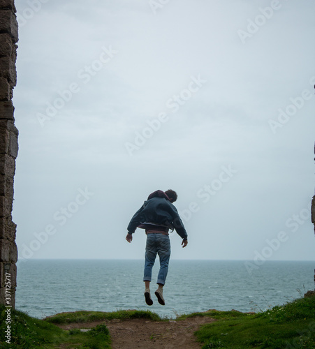 Model levitating near ocean