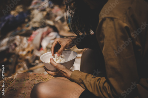 poor people or beggar begging you for help sitting at dirty slum.concept for poverty or hunger people,human rights,donate and charity for underprivileged children in third world ่.
