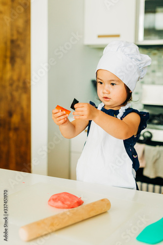 Toddler Girl Baking Cookies