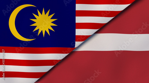 The flags of Malaysia and Latvia. News, reportage, business background. 3d illustration