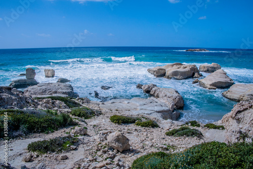 A fresh spring wind drives the waves to the coast of Cyprus. The Mediterranean Sea is painted with dark ultramarine and a luminous azure from the inside. 