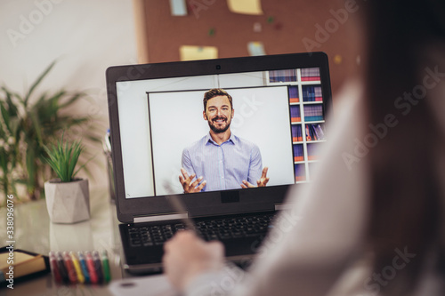 Young student watching lesson online and studying from home.