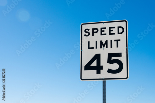 speed limit sign on blue sky