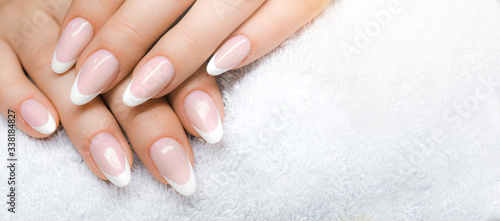 Manicure and Hands Spa. Beautiful Woman hands closeup. Manicured nails and Soft hand skin wide banner.