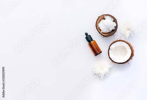 Top view Organic healthy coconut butter with fresh coconut pieces over white background
