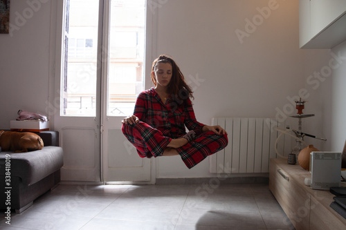 Young woman yogi levitation and meditation concept.