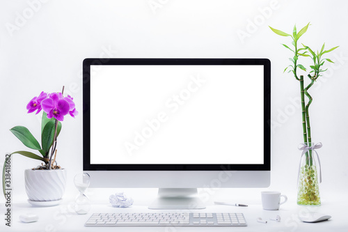 Computer all in one mockup, home and office workspace concept. Computer with white blank screen on work table front view. Copy space