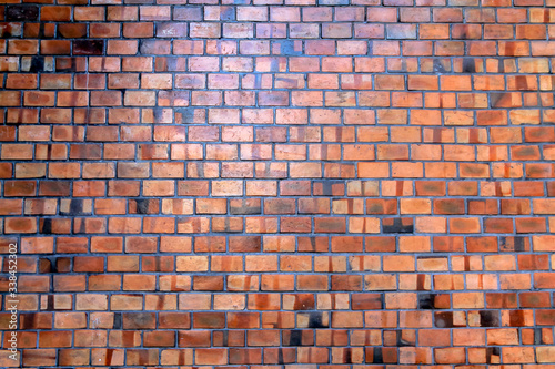 The brick wall background that was created to show the beautiful natural brickwork pattern from the unique clay brick pattern. Copy space on the background of clay bricks for design work.