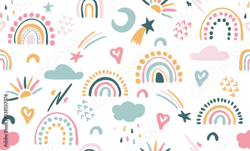 Seamless vector pattern with hand drawn rainbows and sun. Trendy baby texture