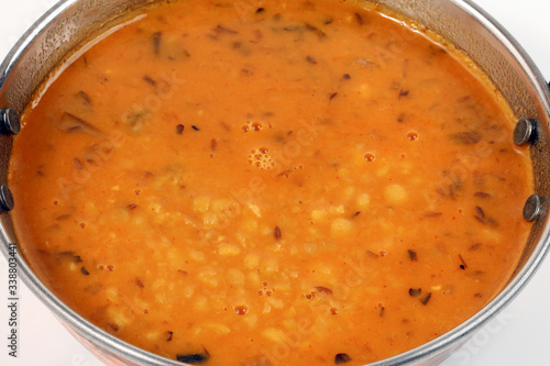 indian style dal lentil tarka spicy ghee fried dish in brass karai bowl pan top view