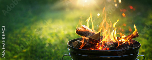 Barbecue Grill with Fire on Open Air. Fire flame