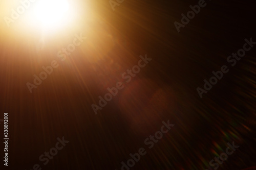 Easy to add lens flare effects for overlay designs or screen blending mode to make high-quality images. Abstract sun burst, digital flare, iridescent glare over black background.