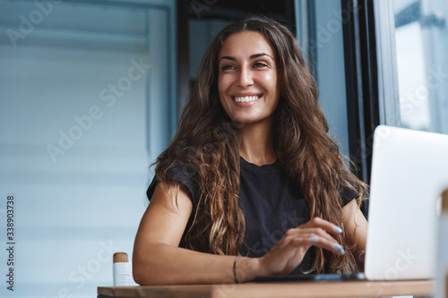 Young businesswoman manage business from home on remote, freelancer using laptop sit kitchen table on self-quarantine, work over personal growth, apply for online courses to learn new skills