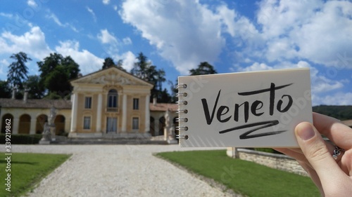 Villa Barbaro designed by Andrea Palladio architect, year 1560, in Maser, Veneto, Italy. View with calligraphic inscription "Veneto" on notebook. Travel destinations. Mobile photography.