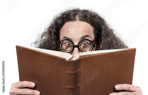 Eccentric, young nerd reading a book