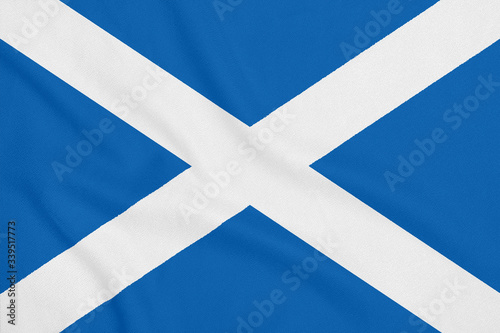 Flag of Scotland on soft and smooth silk texture. National symbol of Scotland.