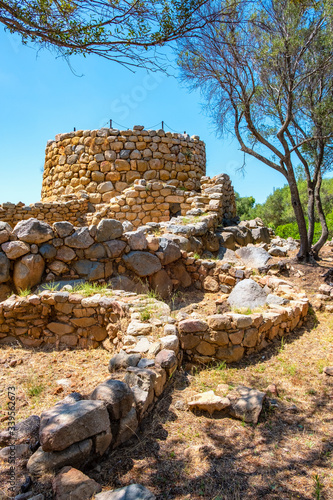 Arzachena, Sardinia, Italy - Archeological ruins of Nuragic complex La Prisgiona - Nuraghe La Prisgiona - with stone main tower and preserved remaining of Neolithic fortress