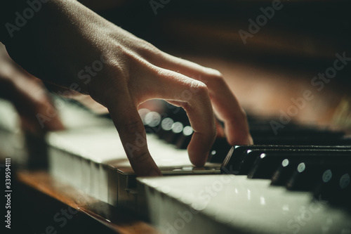 hand on piano keys close-up