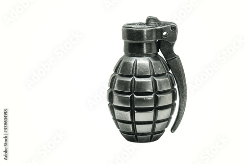 Single silver metal grenade - lighter isolated on white background with shadow and copy space
