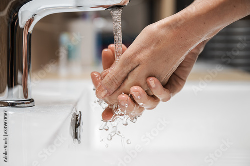 Woman washing her hands