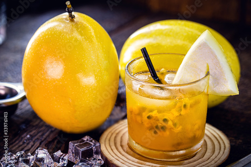 Brazilian caipirinha, typical Brazilian cocktail made with passion fruit, cachaça and sugar. Traditional drink from Brazil known as caipifruta, tropical cocktail of drinks with fresh fruits.