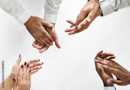 Business people clapping hands together