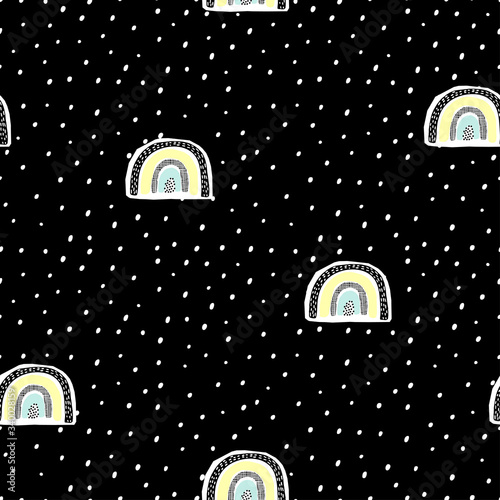 Baby seamless pattern with hand drawn rainbows on a black background. Trendy childish background.