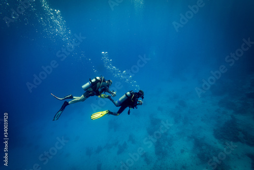 St John's Caves, Red Sea, Egypt - Aug 2016: Divers descend on the reef