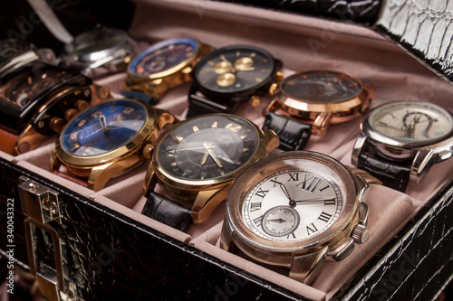 storage box with collection of men wrist watches