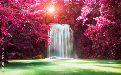 Beautiful waterfall with sunlight in autumn forest at Erawan National Park, Thailand, Nature landscape 