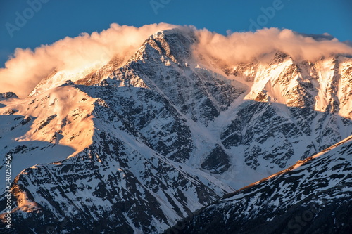 Mount Donguz-Orun at dawn and glacier in the form of the number seven.