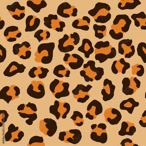 Leopard seamless pattern. Vector animal print. Brown and yellow spots on a beige background. Jaguar, leopard, cheetah, panther fur. Leopard skin imitation can be painted on clothes or fabric.