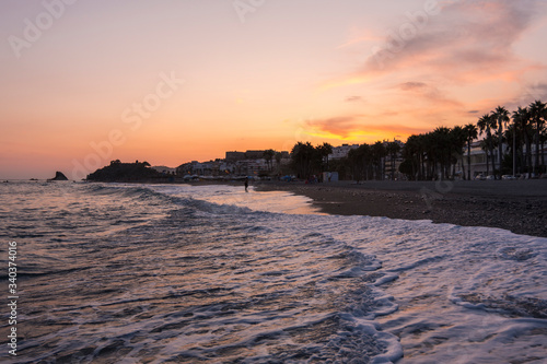 Last lights of the sunset on the beaches of Almuñecar, Granada (Spain)