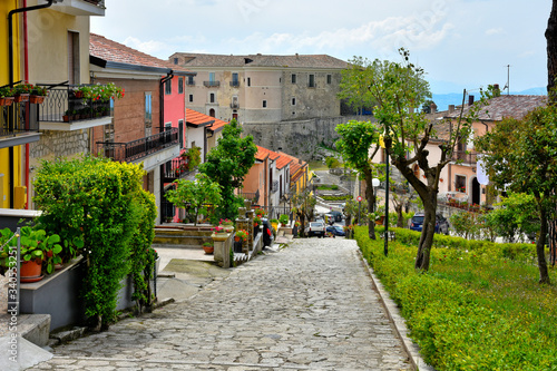 A narrow street between the old houses of Gesualdo, a village in the province of Avellino