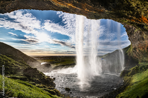 The Seljalandsfoss waterfall in south Iceland during a sunset