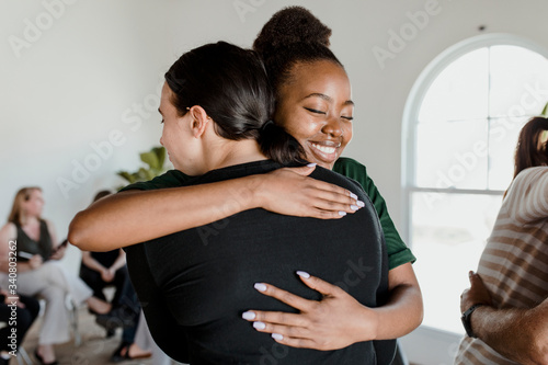 Women hugging each other