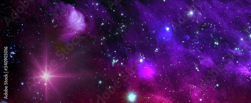 Space background with nebula and shining stars. Colorful cosmos with stardust and milky way. Magic color galaxy. Infinite universe and starry night. Elements of this image furnished by NASA.