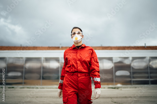 Paramedic in front of isolation ward hospital facility.Coronavirus Covid-19 heroe.Mental strength of medical professional.Emergency room doctor prepared for virus outbreak.Brave nurse on the frontline