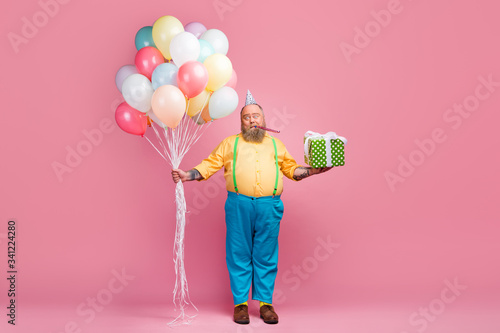 Full length body size view of his he nice funky bearded guy holding in hands bunch air ball giftbox whistling single alone lonely party time isolated over pink pastel color background