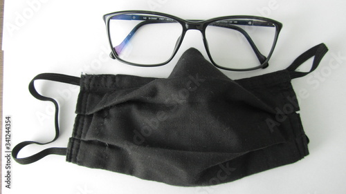 a black anty covid mask and glasses 2
