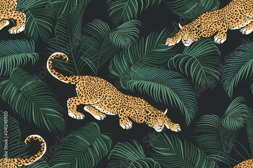 The stalking wild jaguar and palm leaves. .Exotic seamless pattern on a dark background. Hand drawn jungle texture. Vector illustration.